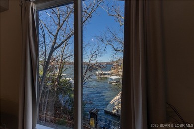 Discover lake living at its finest in the iconic Tan-Tar-A on The Oaks Golf Course in Missouri - for sale on GolfHomes.com, golf home, golf lot