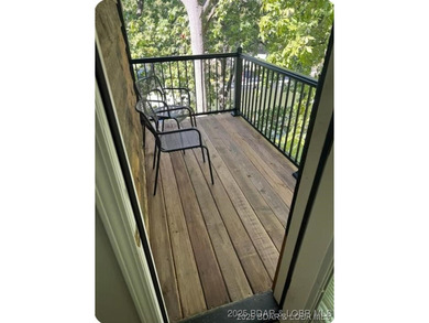 Discover lake living at its finest in the iconic Tan-Tar-A on The Oaks Golf Course in Missouri - for sale on GolfHomes.com, golf home, golf lot