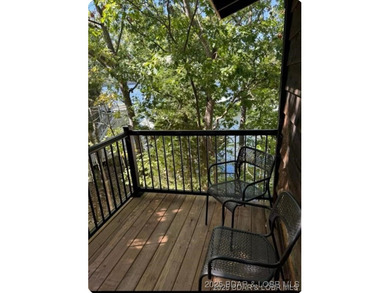 Discover lake living at its finest in the iconic Tan-Tar-A on The Oaks Golf Course in Missouri - for sale on GolfHomes.com, golf home, golf lot