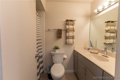 Discover lake living at its finest in the iconic Tan-Tar-A on The Oaks Golf Course in Missouri - for sale on GolfHomes.com, golf home, golf lot