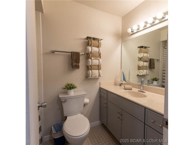 Discover lake living at its finest in the iconic Tan-Tar-A on The Oaks Golf Course in Missouri - for sale on GolfHomes.com, golf home, golf lot