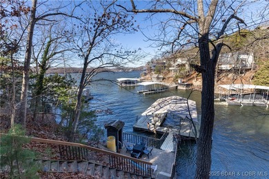 Discover lake living at its finest in the iconic Tan-Tar-A on The Oaks Golf Course in Missouri - for sale on GolfHomes.com, golf home, golf lot