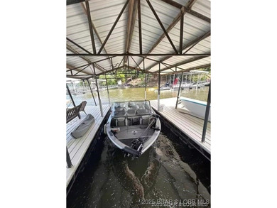 Discover lake living at its finest in the iconic Tan-Tar-A on The Oaks Golf Course in Missouri - for sale on GolfHomes.com, golf home, golf lot