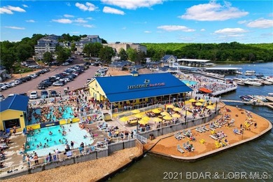 Discover lake living at its finest in the iconic Tan-Tar-A on The Oaks Golf Course in Missouri - for sale on GolfHomes.com, golf home, golf lot