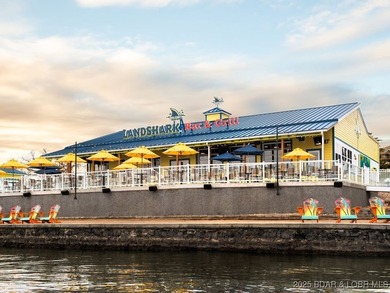 Discover lake living at its finest in the iconic Tan-Tar-A on The Oaks Golf Course in Missouri - for sale on GolfHomes.com, golf home, golf lot