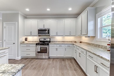 Beautifully updated townhouse tucked away in a peaceful on Cape Fear National At Brunswick Forest in North Carolina - for sale on GolfHomes.com, golf home, golf lot