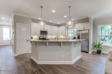Beautifully updated townhouse tucked away in a peaceful on Cape Fear National At Brunswick Forest in North Carolina - for sale on GolfHomes.com, golf home, golf lot