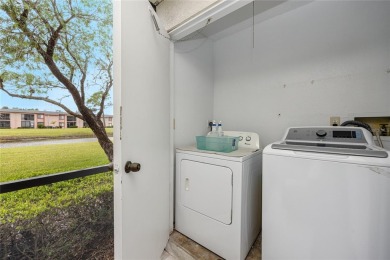 Stunning Waterview Condo in the Gated Community of East Lake on East Lake Woodlands Country Club in Florida - for sale on GolfHomes.com, golf home, golf lot