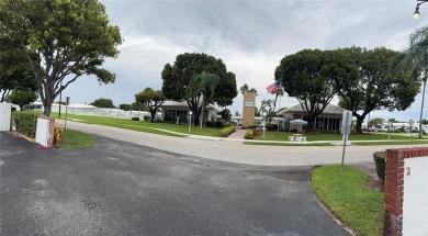 Beautifully maintained 2-bedroom, 1-bath first-floor condo with on Leisureville Community Association in Florida - for sale on GolfHomes.com, golf home, golf lot