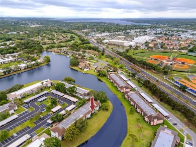 Stunning Waterview Condo in the Gated Community of East Lake on East Lake Woodlands Country Club in Florida - for sale on GolfHomes.com, golf home, golf lot