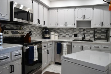 Step into luxury with this exquisite 1-bedroom, 1.5-bathroom on Palm-Aire Country Club and Resort - Palms in Florida - for sale on GolfHomes.com, golf home, golf lot