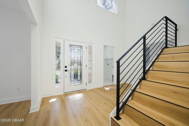 Set on an expansive golf course lot with mature, lush on Spruce Creek Golf Club in Florida - for sale on GolfHomes.com, golf home, golf lot