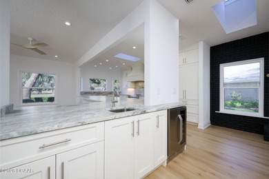 Set on an expansive golf course lot with mature, lush on Spruce Creek Golf Club in Florida - for sale on GolfHomes.com, golf home, golf lot