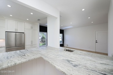 Set on an expansive golf course lot with mature, lush on Spruce Creek Golf Club in Florida - for sale on GolfHomes.com, golf home, golf lot