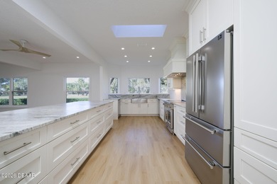 Set on an expansive golf course lot with mature, lush on Spruce Creek Golf Club in Florida - for sale on GolfHomes.com, golf home, golf lot