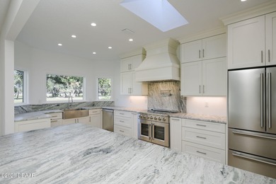 Set on an expansive golf course lot with mature, lush on Spruce Creek Golf Club in Florida - for sale on GolfHomes.com, golf home, golf lot