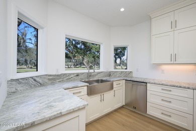 Set on an expansive golf course lot with mature, lush on Spruce Creek Golf Club in Florida - for sale on GolfHomes.com, golf home, golf lot