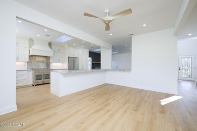 Set on an expansive golf course lot with mature, lush on Spruce Creek Golf Club in Florida - for sale on GolfHomes.com, golf home, golf lot