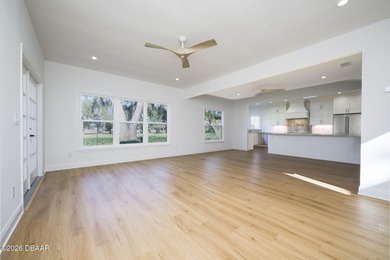 Set on an expansive golf course lot with mature, lush on Spruce Creek Golf Club in Florida - for sale on GolfHomes.com, golf home, golf lot