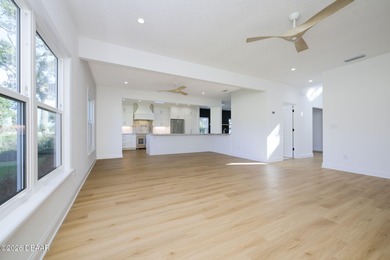 Set on an expansive golf course lot with mature, lush on Spruce Creek Golf Club in Florida - for sale on GolfHomes.com, golf home, golf lot