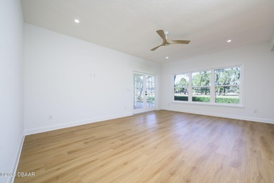 Set on an expansive golf course lot with mature, lush on Spruce Creek Golf Club in Florida - for sale on GolfHomes.com, golf home, golf lot