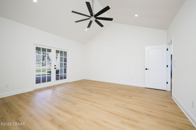 Set on an expansive golf course lot with mature, lush on Spruce Creek Golf Club in Florida - for sale on GolfHomes.com, golf home, golf lot