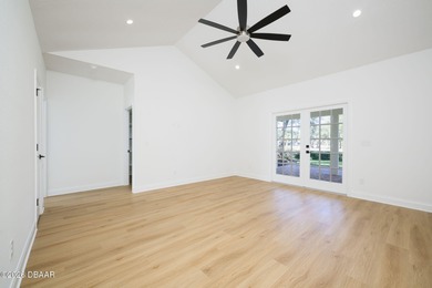 Set on an expansive golf course lot with mature, lush on Spruce Creek Golf Club in Florida - for sale on GolfHomes.com, golf home, golf lot