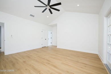 Set on an expansive golf course lot with mature, lush on Spruce Creek Golf Club in Florida - for sale on GolfHomes.com, golf home, golf lot