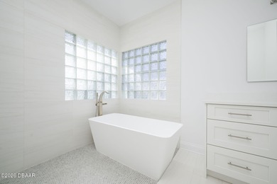 Set on an expansive golf course lot with mature, lush on Spruce Creek Golf Club in Florida - for sale on GolfHomes.com, golf home, golf lot