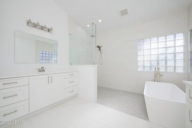 Set on an expansive golf course lot with mature, lush on Spruce Creek Golf Club in Florida - for sale on GolfHomes.com, golf home, golf lot