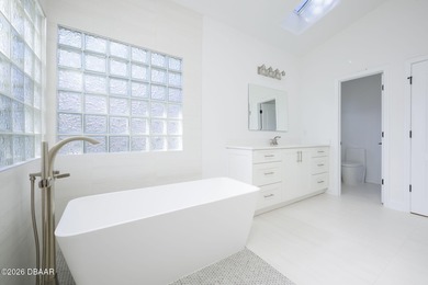 Set on an expansive golf course lot with mature, lush on Spruce Creek Golf Club in Florida - for sale on GolfHomes.com, golf home, golf lot