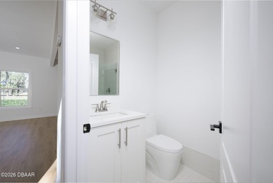 Set on an expansive golf course lot with mature, lush on Spruce Creek Golf Club in Florida - for sale on GolfHomes.com, golf home, golf lot