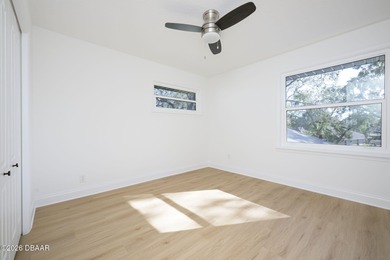 Set on an expansive golf course lot with mature, lush on Spruce Creek Golf Club in Florida - for sale on GolfHomes.com, golf home, golf lot