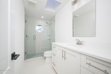 Set on an expansive golf course lot with mature, lush on Spruce Creek Golf Club in Florida - for sale on GolfHomes.com, golf home, golf lot