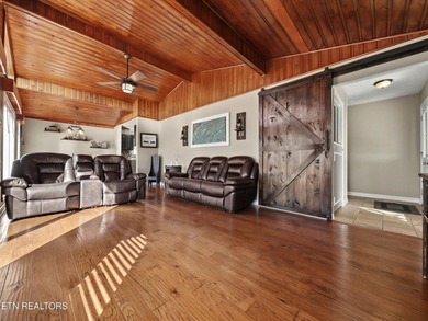 Want a comfortable cabin at the lake? This home offers wooded on The Greens at Deerfield in Tennessee - for sale on GolfHomes.com, golf home, golf lot