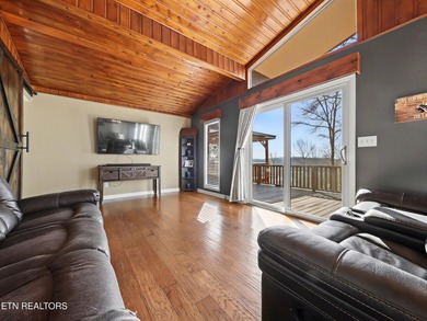 Want a comfortable cabin at the lake? This home offers wooded on The Greens at Deerfield in Tennessee - for sale on GolfHomes.com, golf home, golf lot