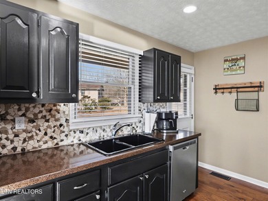 Want a comfortable cabin at the lake? This home offers wooded on The Greens at Deerfield in Tennessee - for sale on GolfHomes.com, golf home, golf lot