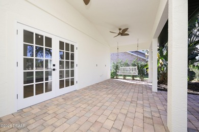 Set on an expansive golf course lot with mature, lush on Spruce Creek Golf Club in Florida - for sale on GolfHomes.com, golf home, golf lot