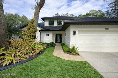 Set on an expansive golf course lot with mature, lush on Spruce Creek Golf Club in Florida - for sale on GolfHomes.com, golf home, golf lot