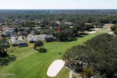 Set on an expansive golf course lot with mature, lush on Spruce Creek Golf Club in Florida - for sale on GolfHomes.com, golf home, golf lot