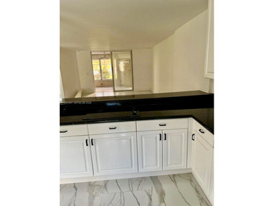 This beautifully remodeled 2-bedroom, 2-bath unit features a on Oriole Golf and Tennis Club in Florida - for sale on GolfHomes.com, golf home, golf lot