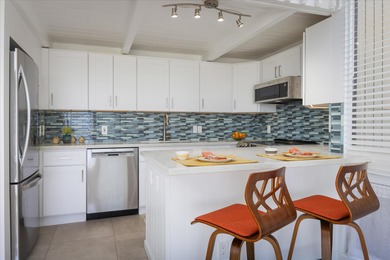 Step into this top floor condo and you'll be immediately drawn on Waikoloa Village Golf Club in Hawaii - for sale on GolfHomes.com, golf home, golf lot