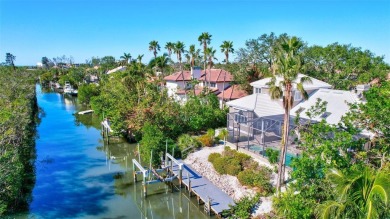 This stunning 4-bedroom home, located on the tranquil Bay Isles on Longboat Key Golf Club in Florida - for sale on GolfHomes.com, golf home, golf lot