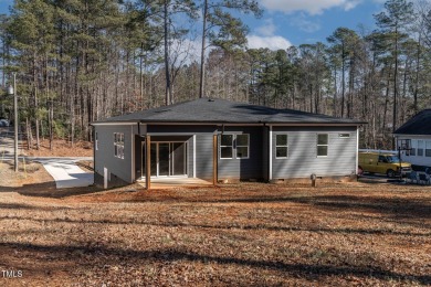 This modern custom-built home in Lake Royale is absolutely on River Golf and County Club at Lake Royale in North Carolina - for sale on GolfHomes.com, golf home, golf lot