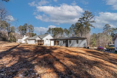 This modern custom-built home in Lake Royale is absolutely on River Golf and County Club at Lake Royale in North Carolina - for sale on GolfHomes.com, golf home, golf lot