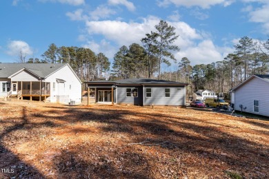 This modern custom-built home in Lake Royale is absolutely on River Golf and County Club at Lake Royale in North Carolina - for sale on GolfHomes.com, golf home, golf lot