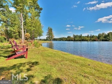 DISCOVER EXCEPTIONAL LAKEFRONT LIVING in the highly sought-after on Summergrove Golf Club in Georgia - for sale on GolfHomes.com, golf home, golf lot