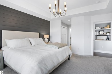 Welcome to 2764 W Crown Drive--a stunning 2022 ranch-style home on Crown Golf Course in Michigan - for sale on GolfHomes.com, golf home, golf lot