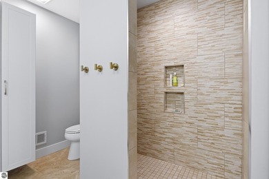 Welcome to 2764 W Crown Drive--a stunning 2022 ranch-style home on Crown Golf Course in Michigan - for sale on GolfHomes.com, golf home, golf lot