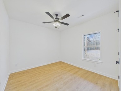 This inviting new construction Bella Vista home sits in a prime on Branchwood Golf Course in Arkansas - for sale on GolfHomes.com, golf home, golf lot